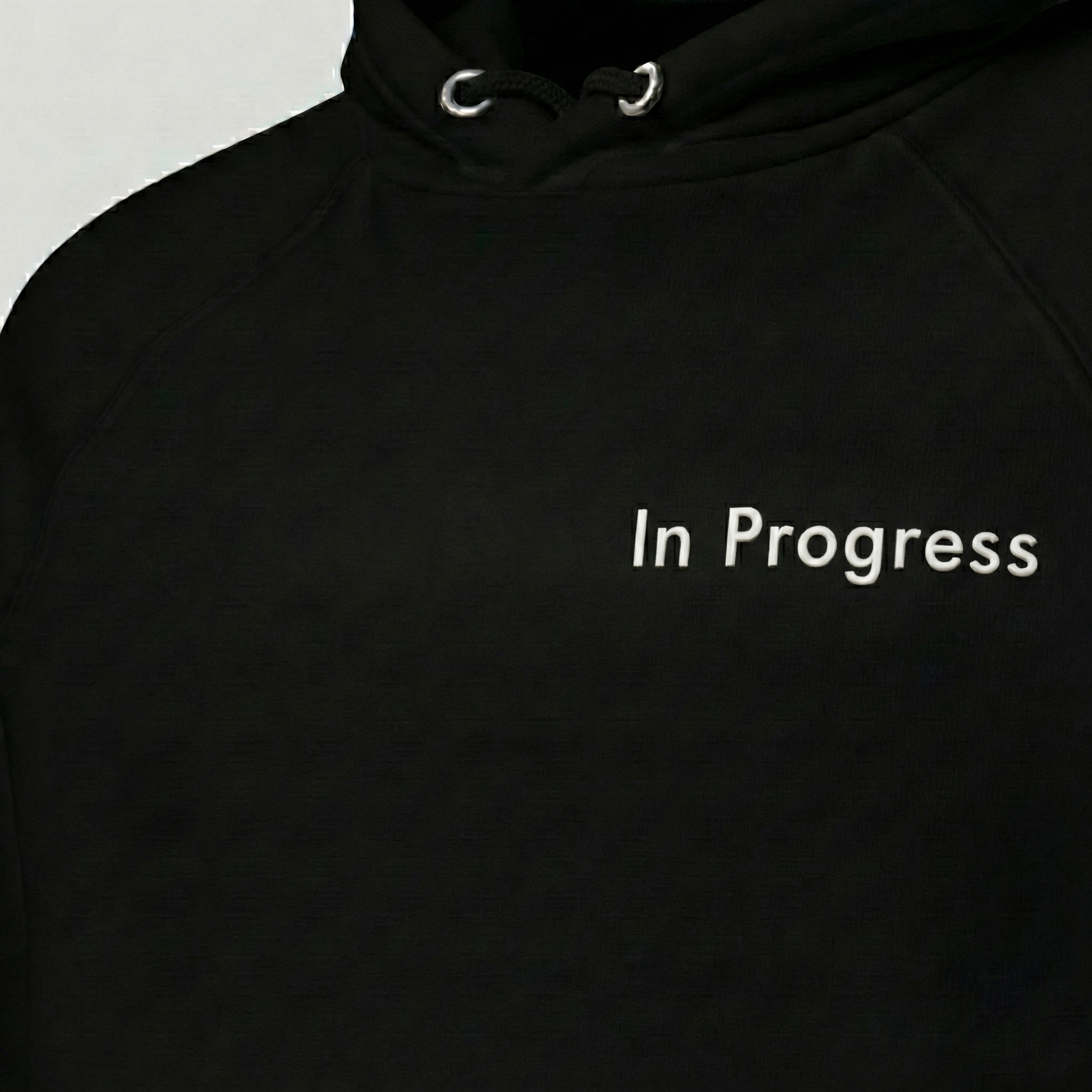 Black In Progress hoodie with minimalist text print