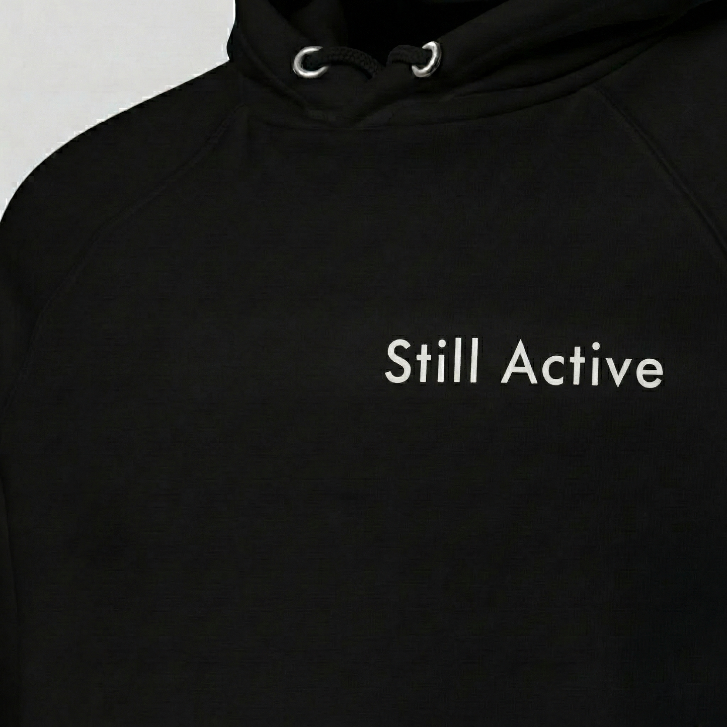 Black Still Active hoodie with minimalist text print