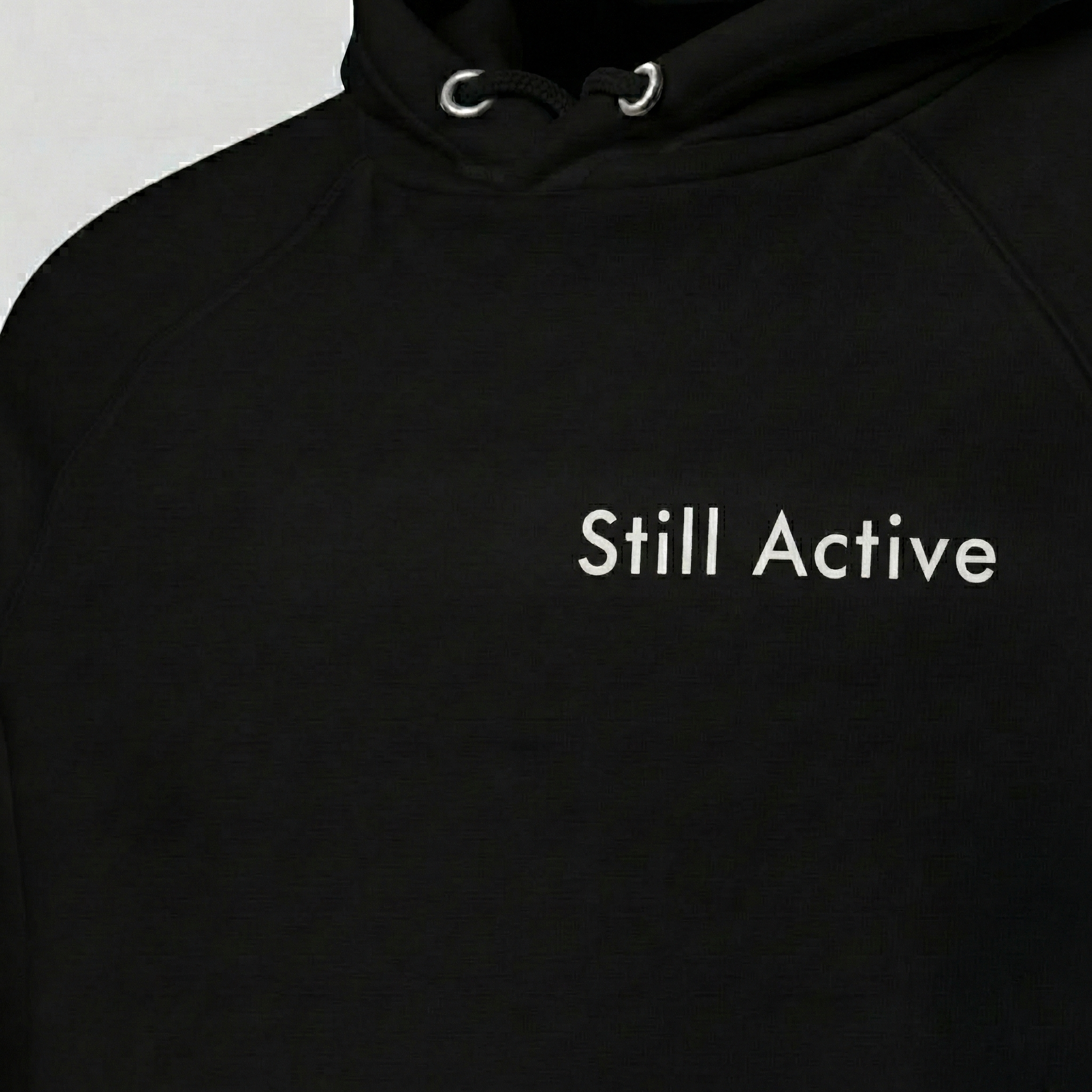 Black Still Active hoodie with minimalist text print